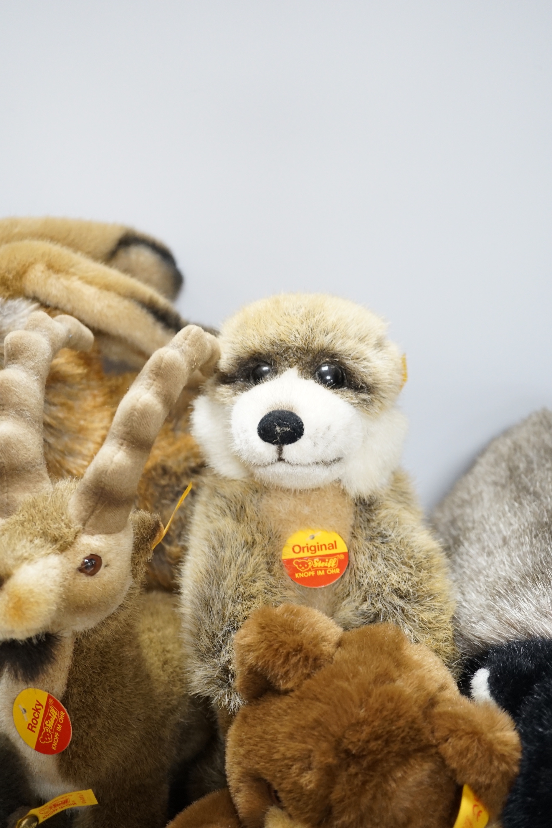 Seven Steiff animals, yellow tag: bear, Sigi badger, Rocky, Muneeb hare, Meerkat and others